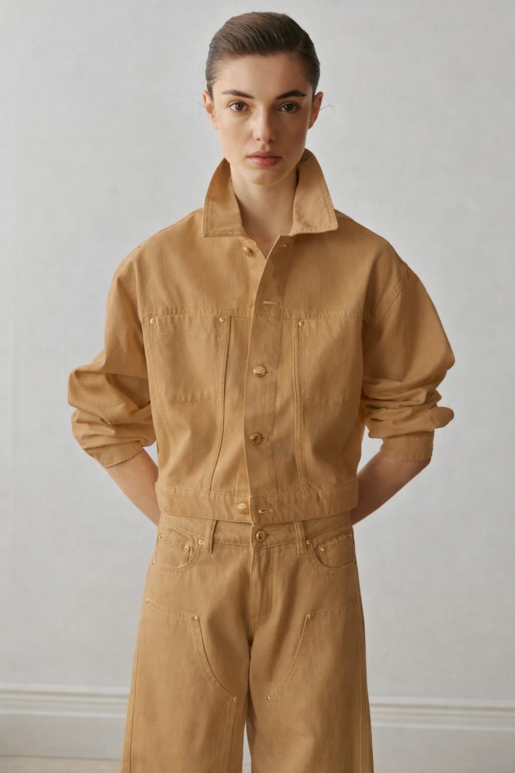 Tan denim jacket with matching wide-leg pants and gold buttons